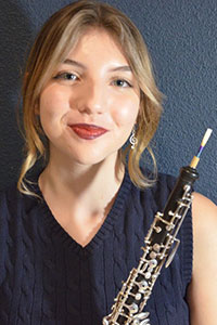 Catalina Huss posing with her oboe